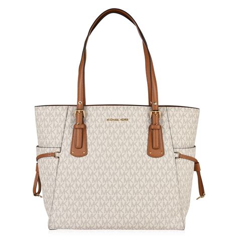 michael michael kors grained leather voyager tote bag|Michael Kors saffiano leather bag.